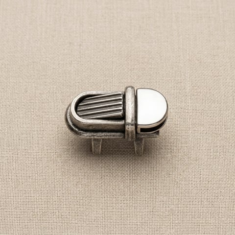 Antique silver fluted flip clip footwear fitting on linen