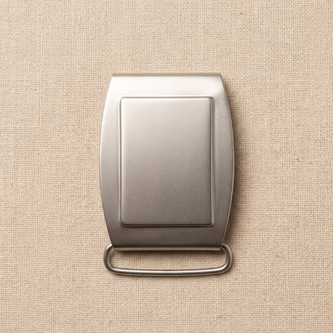 Antique nickel arched plate belt buckle on linen