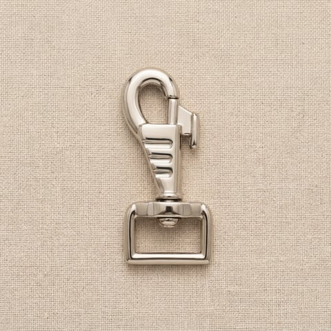 Polished nickel ribbed swivel snap hook on linen