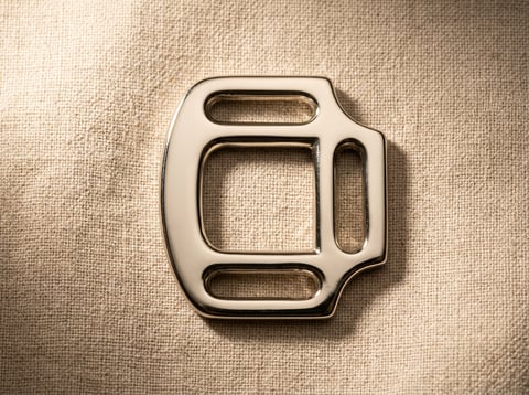 Polished nickel halter square harness buckle on linen