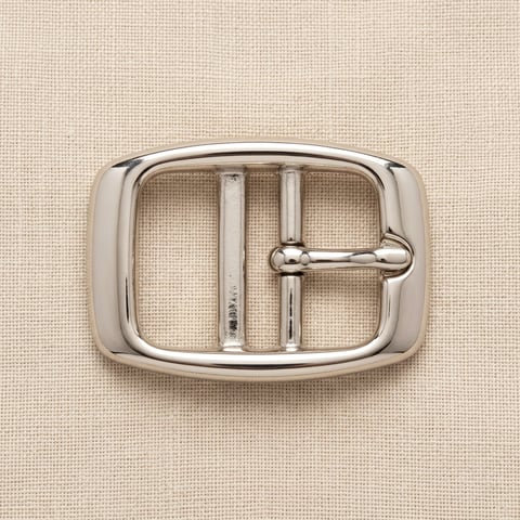 Polished nickel oval centre-bar belt buckle on linen