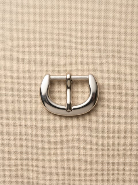 Polished nickel half-round pin belt buckle on linen