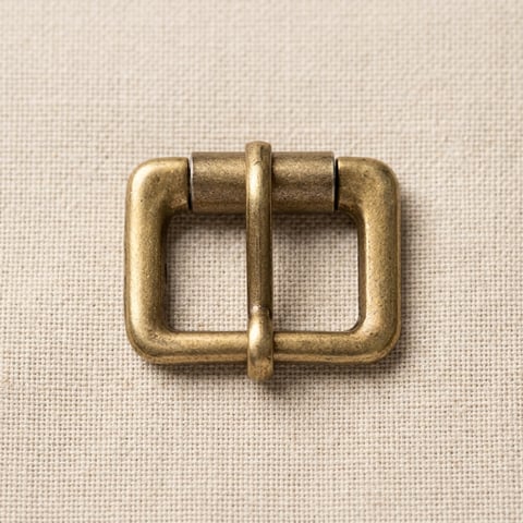Antique brass square roller buckle on linen