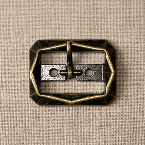 Antique brass octagon footwear buckle with nickel plates on linen