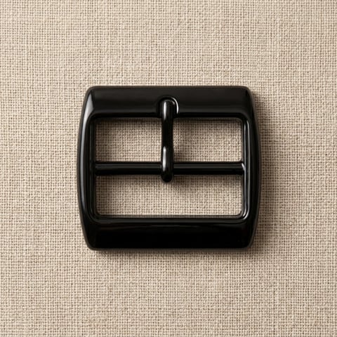 Gloss black double-bar footwear buckle on linen