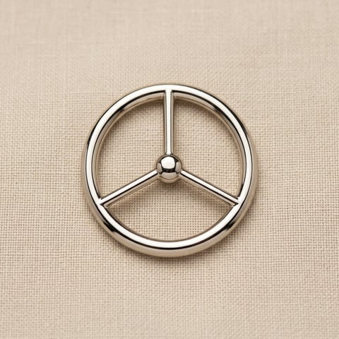 Polished nickel tri-spoke round ring on linen
