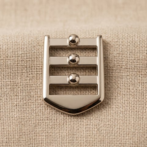 Polished nickel three-bar studded slide buckle on linen