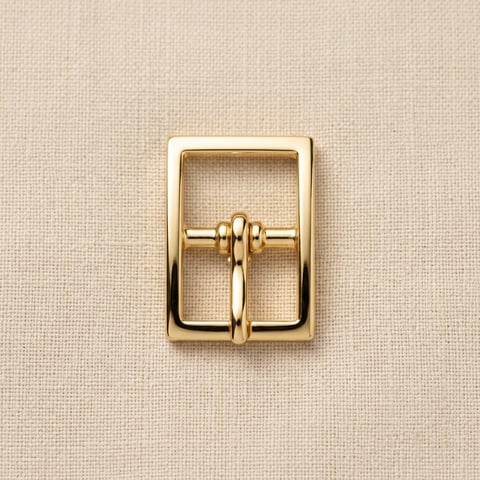 Polished gold rectangular pin belt buckle on linen