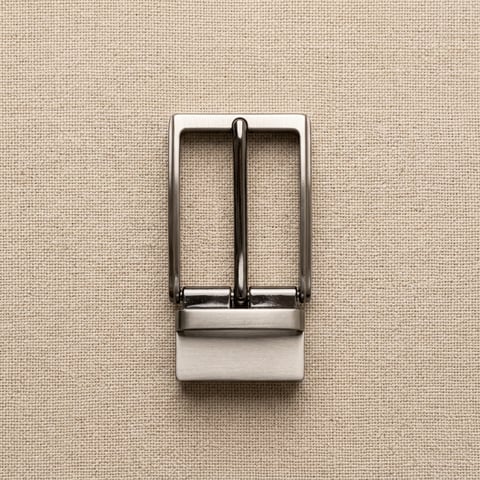Polished nickel rectangular belt buckle on linen