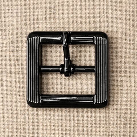 Gloss black fluted square footwear buckle on linen
