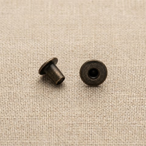 Antique bronze flat head rivet studs on linen
