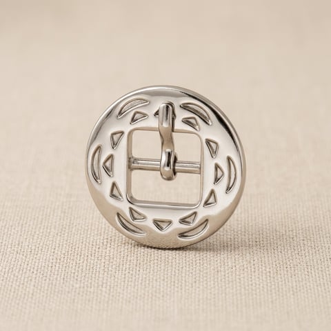 Polished nickel round medallion buckle on linen