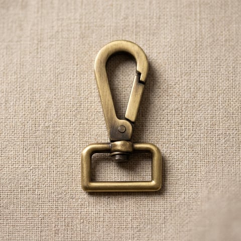 Antique brass square loop snap hook on linen