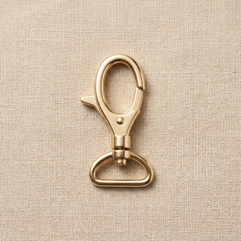 Polished gold trigger swivel snap hook on linen